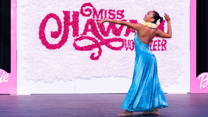 Kinsler dancing on the Miss Hawaii volunteer stage