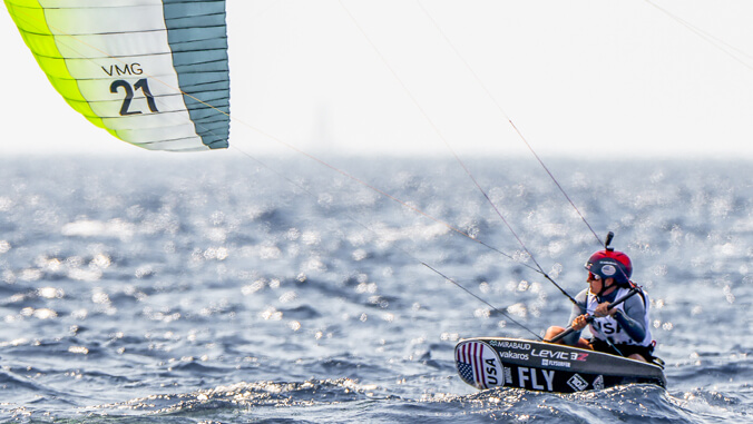 person riding a kiteboard in the water