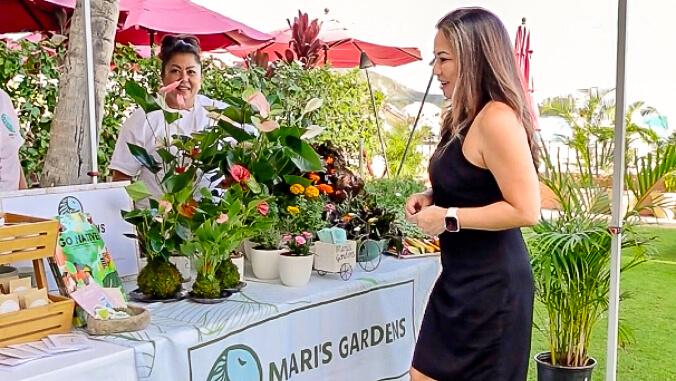 Two people at a plant table