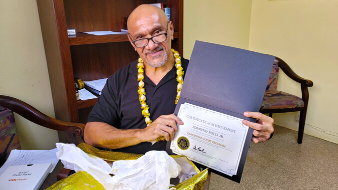 man holding a certificate