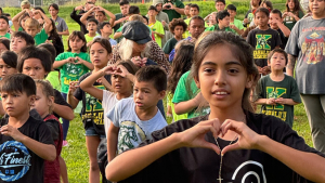 kids making heart gestures