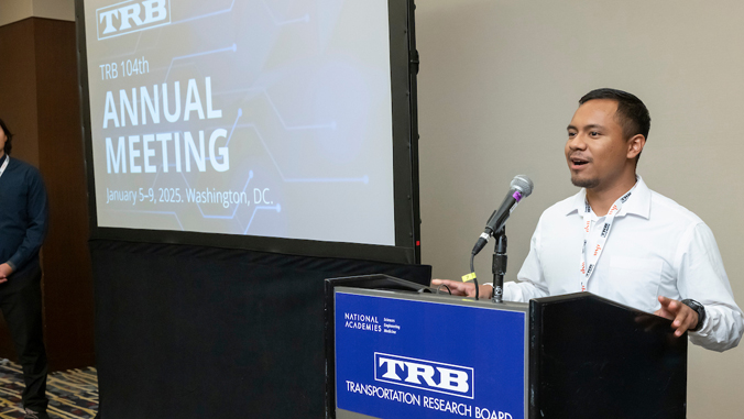 person speaking at a podium