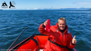 researcher holding tagging device