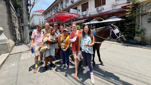 people standing in front of a horse