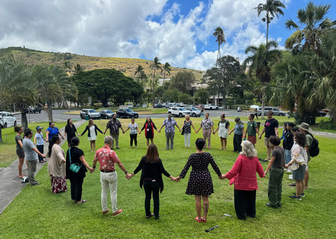 People holding hands in a circle