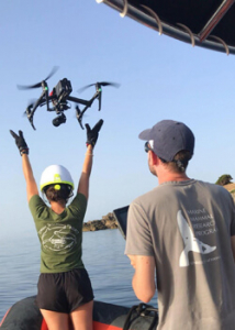 two people launching drone