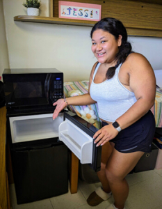 Student presents her new micro fridge.