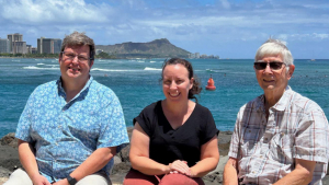 three people smiling