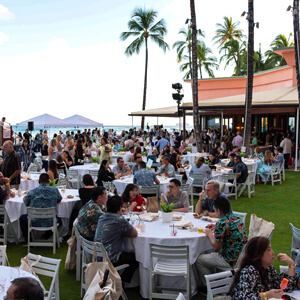 people sitting outdoors at tables