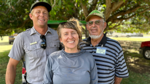 Three smiling people