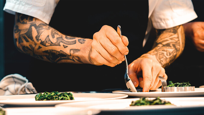 Hands plating food