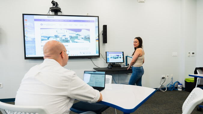 two people at desks