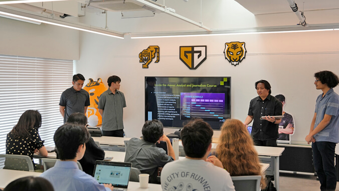 people standing at the front of a classroom