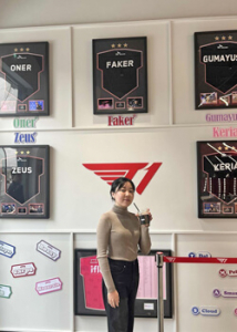 person standing in front of a large wall with jerseys