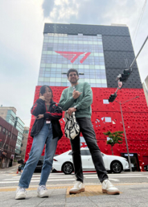 two people standing in front of a large building