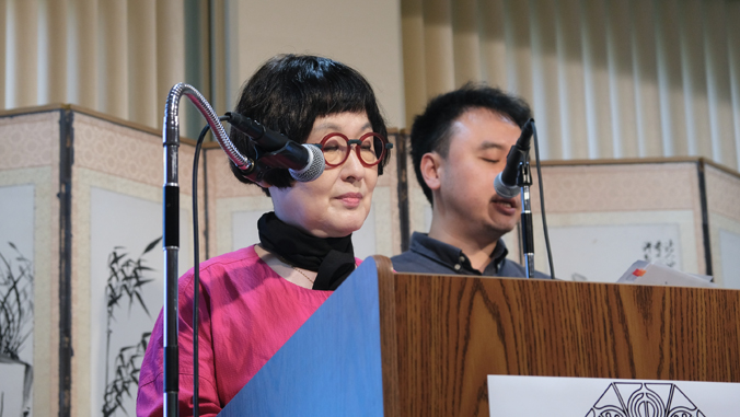 two people at podium