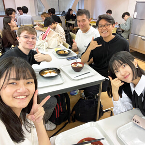 people sitting down eating lunch