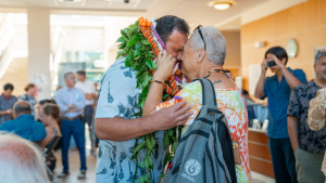 Kaholokula greeting woman