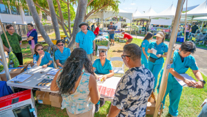 people talking with experts at a booth