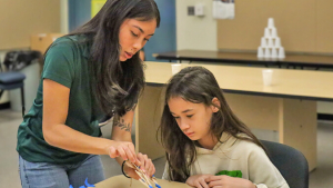 person helping a student