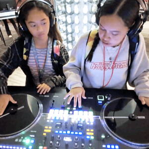 2 students at a recording station