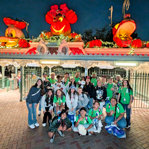 large group in front of Disneyland