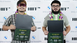 2 people standing in front of H I F F white background