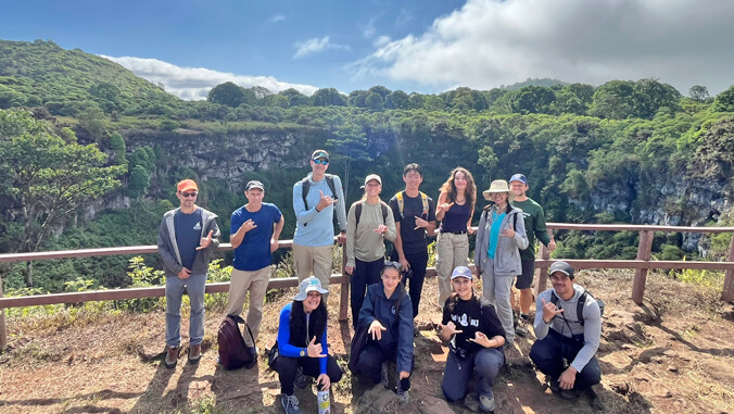 people standing in front of a large gorge