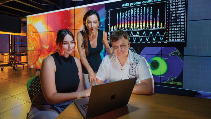 people looking at a computer