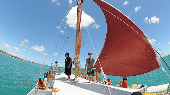 People aboard a canoe