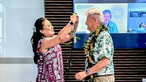 Lassner receiving a lei