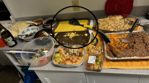 Corn casserole on a table of Thanksgiving dishes