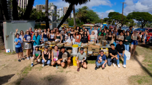 large group of people holding genki balls