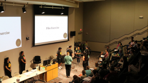 People doing an exercise in an auditorium