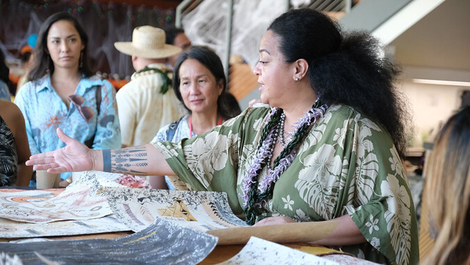 person showcasing polynesian treasures