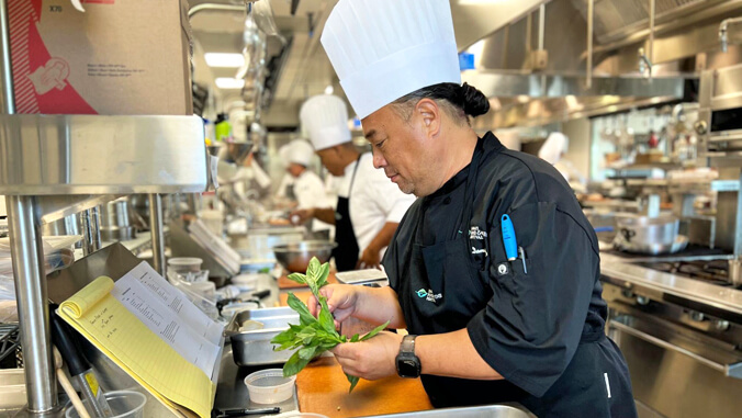 a  chef in a kitchen preparing food