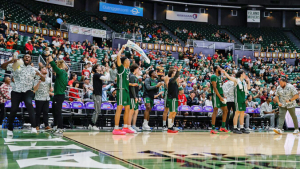 players jumping up and down on the basketball court