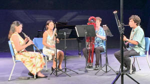 4 people playing musical instruments 