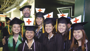 people standing in caps and gowns