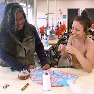 2 people working on kimono