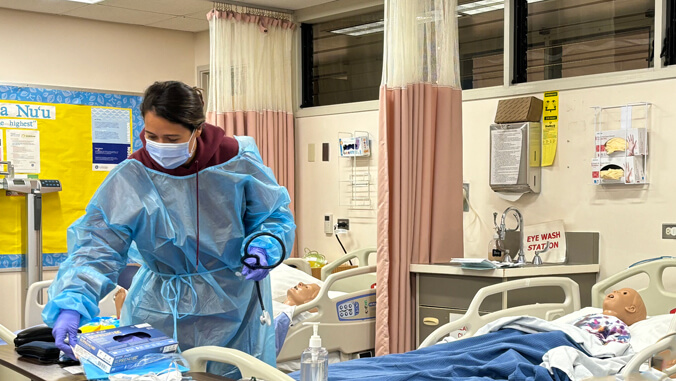 Nursing student with sim patients