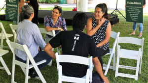 people sitting in chairs talking