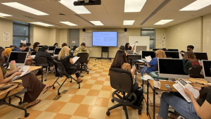 person talking to a room full of students