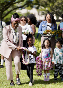 people holding lei