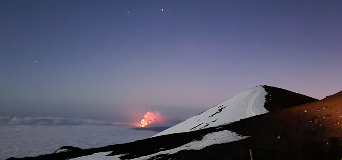 The view from Maunakea of Kilauea erupting