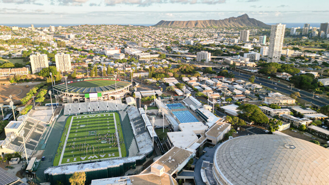 Aerial shot of U H Manoa athletics facilities with Leahi (Diamond Head) and the city of Honolulu in the background