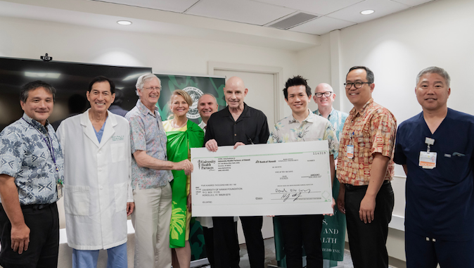 group photo with big check