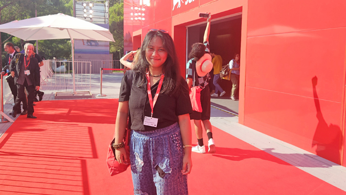 person standing on a red carpet